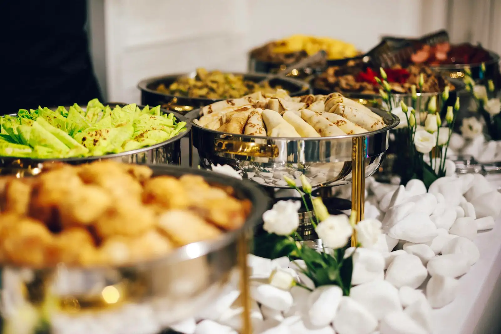 A catering spread of hibachi trays and bento boxes from Hibachi K and Sushi in Raleigh